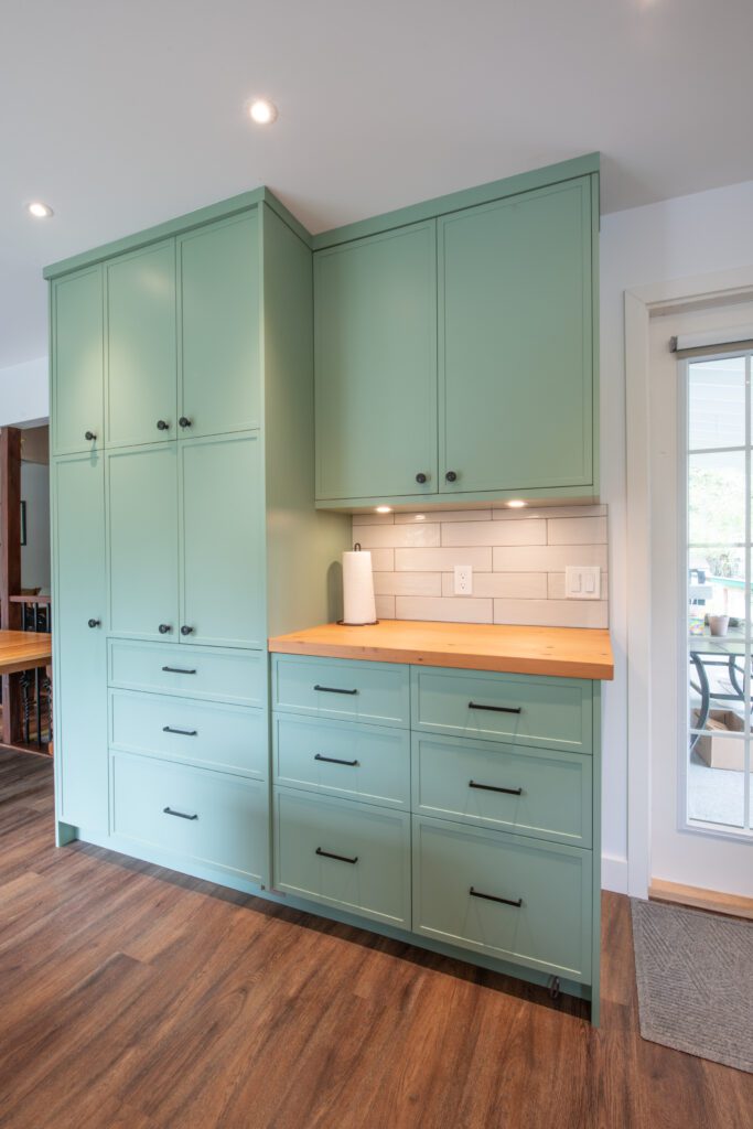 Kitchen cabinets and entryway storage/cabinetry.
