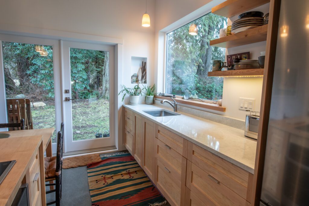 Unique post and beam cabin requiring new kitchen cabinets and bathroom vanity.
